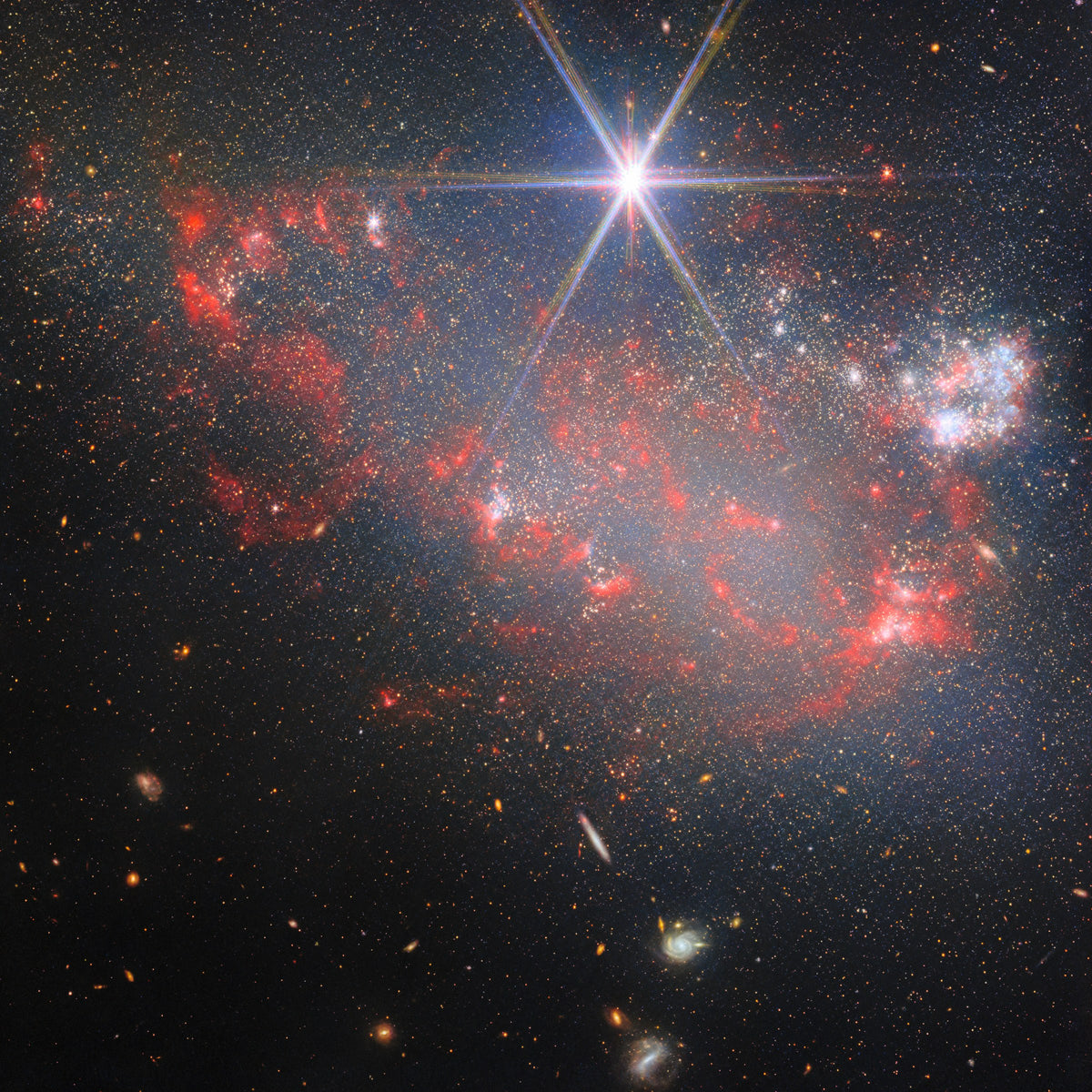 Arp 263. Irregular galaxy NGC 3239, star clusters and red dust, a spiked foreground star.